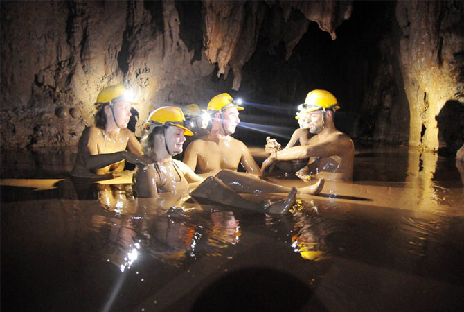 Have a Mud Bath in Tối (Dark) Cave and Zipline on Chày River